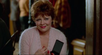 Movie still from “Moonstruck” (1987), directed by Norman Jewison – A person holding a cell phone; Close Up shot, Over the shoulder angle