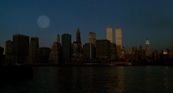 Movie still from “Moonstruck” (1987), directed by Norman Jewison – A view of the skyline of a city at night; Extreme Wide shot, Low angle