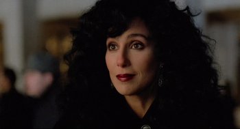 Movie still from “Moonstruck” (1987), directed by Norman Jewison – A person with long hair; Close Up shot, Over the shoulder angle