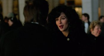 Movie still from “Moonstruck” (1987), directed by Norman Jewison – A person with long hair; Close Up shot, Over the shoulder angle