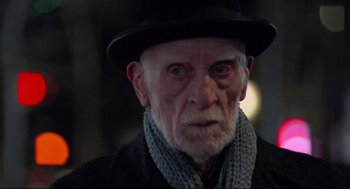 Movie still from “Moonstruck” (1987), directed by Norman Jewison – An old man wearing a hat and a scarf; Close Up shot, Low angle