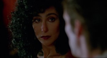 Movie still from “Moonstruck” (1987), directed by Norman Jewison – A person looking at a mirror; Close Up shot, Over the shoulder angle