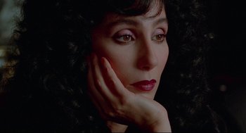 Movie still from “Moonstruck” (1987), directed by Norman Jewison – A person with her hand on her face; Close Up shot, High angle