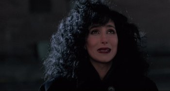 Movie still from “Moonstruck” (1987), directed by Norman Jewison – A person wearing a black jacket; Close Up shot, High angle
