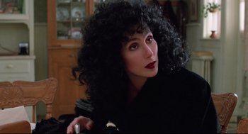 Movie still from “Moonstruck” (1987), directed by Norman Jewison – A person wearing a wig; Close Up shot, Over the shoulder angle