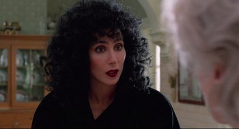 Movie still from “Moonstruck” (1987), directed by Norman Jewison – A person wearing a wig; Close Up shot, Over the shoulder angle