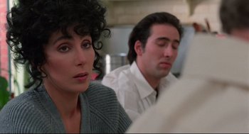 Movie still from “Moonstruck” (1987), directed by Norman Jewison – A woman sitting next to a man in front of a mirror; Close Up shot, Over the shoulder angle