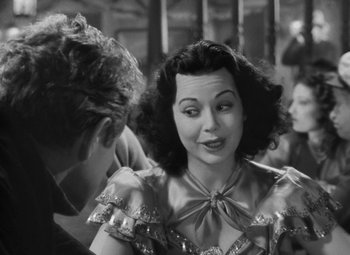 Movie still from “Moontide” (1942), directed by Fritz Lang – An old black and white photo of a woman talking to a man; Close Up shot, Over the shoulder angle