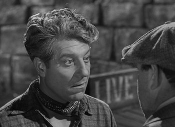 Movie still from “Moontide” (1942), directed by Fritz Lang – An old black and white photo of a man and a horse; Close Up shot, Over the shoulder angle