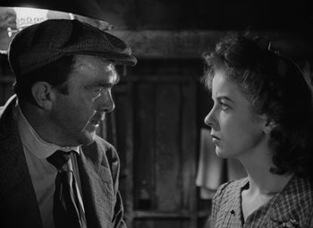 Movie still from “Moontide” (1942), directed by Fritz Lang – A man and a woman are looking at one another; Close Up shot, Low angle