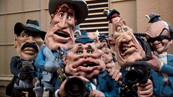 Movie still from “Moonwalker” (1988), directed by Jerry Kramer – A group of people that are standing in a group; Close Up shot, Low angle