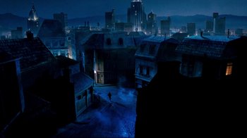 Movie still from “Moonwalker” (1988), directed by Jerry Kramer – An image of a night scene of a city; Extreme Wide shot, High angle