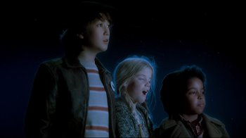 Movie still from “Moonwalker” (1988), directed by Jerry Kramer – A group of young people standing next to each other; Medium shot, Low angle