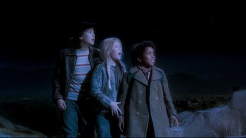 Movie still from “Moonwalker” (1988), directed by Jerry Kramer – A group of children standing next to each other; Medium shot, High angle