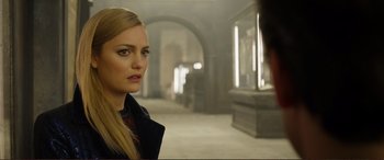 Movie still from “Mortal Engines” (2018), directed by Christian Rivers – A woman standing in an empty room looking at the camera; Close Up shot, Over the shoulder angle