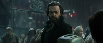 Movie still from “Mortal Engines” (2018), directed by Christian Rivers – A person wearing a jacket; Close Up shot, Low angle