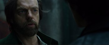 Movie still from “Mortal Engines” (2018), directed by Christian Rivers – A person with a beard; Close Up shot, Over the shoulder angle