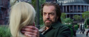 Movie still from “Mortal Engines” (2018), directed by Christian Rivers – A person with long hair and a beard; Close Up shot, Over the shoulder angle