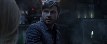 Movie still from “Mortal Engines” (2018), directed by Christian Rivers – A person wearing a jacket; Close Up shot, Over the shoulder angle