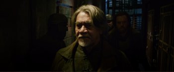 Movie still from “Mortal Engines” (2018), directed by Christian Rivers – A person with a beard; Medium shot, Over the shoulder angle