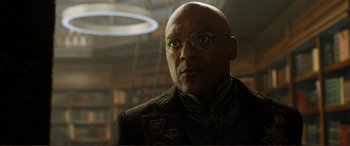 Movie still from “Mortal Engines” (2018), directed by Christian Rivers – A man in a military uniform looking at the camera; Close Up shot, Low angle