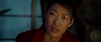 Movie still from “Mortal Engines” (2018), directed by Christian Rivers – A person wearing a red jacket; Close Up shot, Over the shoulder angle