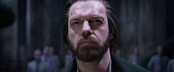 Movie still from “Mortal Engines” (2018), directed by Christian Rivers – A person with a beard; Close Up shot, Low angle
