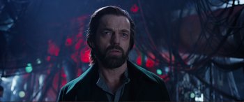 Movie still from “Mortal Engines” (2018), directed by Christian Rivers – A person with a beard looking at the camera; Close Up shot, Low angle