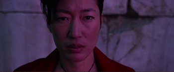 Movie still from “Mortal Engines” (2018), directed by Christian Rivers – A person's face in a purple light; Close Up shot, High angle