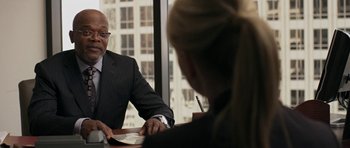 Movie still from “Mother and Child” (2009), directed by Rodrigo García – A man and a woman are sitting in front of a window; Medium shot, Over the shoulder angle