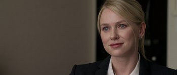 Movie still from “Mother and Child” (2009), directed by Rodrigo García – A person wearing a suit and tie; Close Up shot, Over the shoulder angle