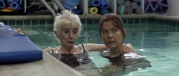 Movie still from “Mother and Child” (2009), directed by Rodrigo García – Two older women in a pool of water; Close Up shot, Over the shoulder angle
