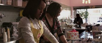 Movie still from “Mother and Child” (2009), directed by Rodrigo García – Two women in a kitchen preparing a cake; Medium shot, Over the shoulder angle