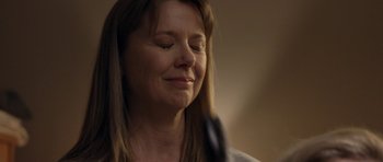 Movie still from “Mother and Child” (2009), directed by Rodrigo García – A person holding a hair brush; Close Up shot, Low angle