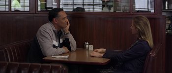 Movie still from “Mother and Child” (2009), directed by Rodrigo García – Two people sitting at a table in a restaurant; Medium shot, Over the shoulder angle