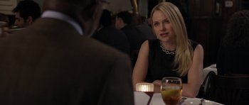 Movie still from “Mother and Child” (2009), directed by Rodrigo García – A woman sitting in front of a man at a table; Close Up shot, Over the shoulder angle