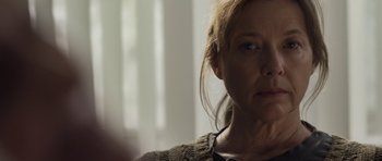 Movie still from “Mother and Child” (2009), directed by Rodrigo García – A person wearing a sweater; Close Up shot, Over the shoulder angle