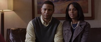 Movie still from “Mother and Child” (2009), directed by Rodrigo García – A man and a woman standing next to each other in a room; Close Up shot, Over the shoulder angle