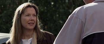 Movie still from “Mother and Child” (2009), directed by Rodrigo García – A person wearing a jacket; Close Up shot, Over the shoulder angle