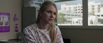 Movie still from “Mother and Child” (2009), directed by Rodrigo García – A woman with blonde hair wearing a pink and white polka dot shirt; Close Up shot, Over the shoulder angle