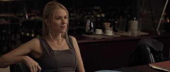 Movie still from “Mother and Child” (2009), directed by Rodrigo García – A woman sitting at a table in front of a counter; Medium shot, Over the shoulder angle