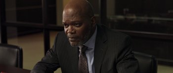 Movie still from “Mother and Child” (2009), directed by Rodrigo García – An older man in a suit and tie looking to his left; Close Up shot, Over the shoulder angle