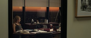 Movie still from “Mother and Child” (2009), directed by Rodrigo García – An office desk with papers and cups on top of it; Wide shot, High angle