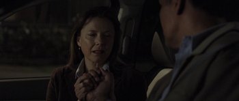 Movie still from “Mother and Child” (2009), directed by Rodrigo García – A woman holding her hands in front of a man in a car; Close Up shot, Over the shoulder angle