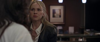 Movie still from “Mother and Child” (2009), directed by Rodrigo García – A woman with long blonde hair wearing a black jacket; Close Up shot, Over the shoulder angle