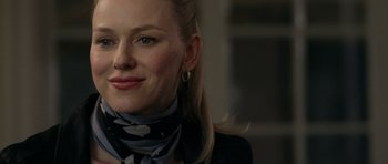 Movie still from “Mother and Child” (2009), directed by Rodrigo García – A person wearing a neck scarf; Close Up shot, Over the shoulder angle