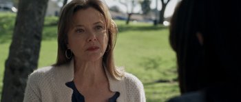 Movie still from “Mother and Child” (2009), directed by Rodrigo García – A person with long blonde hair; Close Up shot, Over the shoulder angle