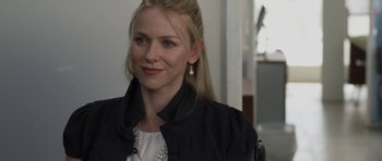 Movie still from “Mother and Child” (2009), directed by Rodrigo García – A woman with long blonde hair wearing a black jacket; Close Up shot, Over the shoulder angle