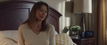 Movie still from “Mother and Child” (2009), directed by Rodrigo García – A woman sitting on a bed in front of a window; Close Up shot, Over the shoulder angle