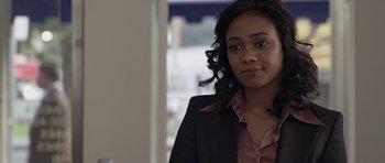 Movie still from “Mother and Child” (2009), directed by Rodrigo García – A person wearing a suit and tie; Close Up shot, Over the shoulder angle